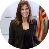 A person in a black suit

AI-generated content may be incorrect.