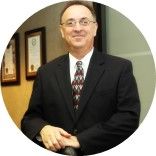 A person in a suit and tie

AI-generated content may be incorrect.